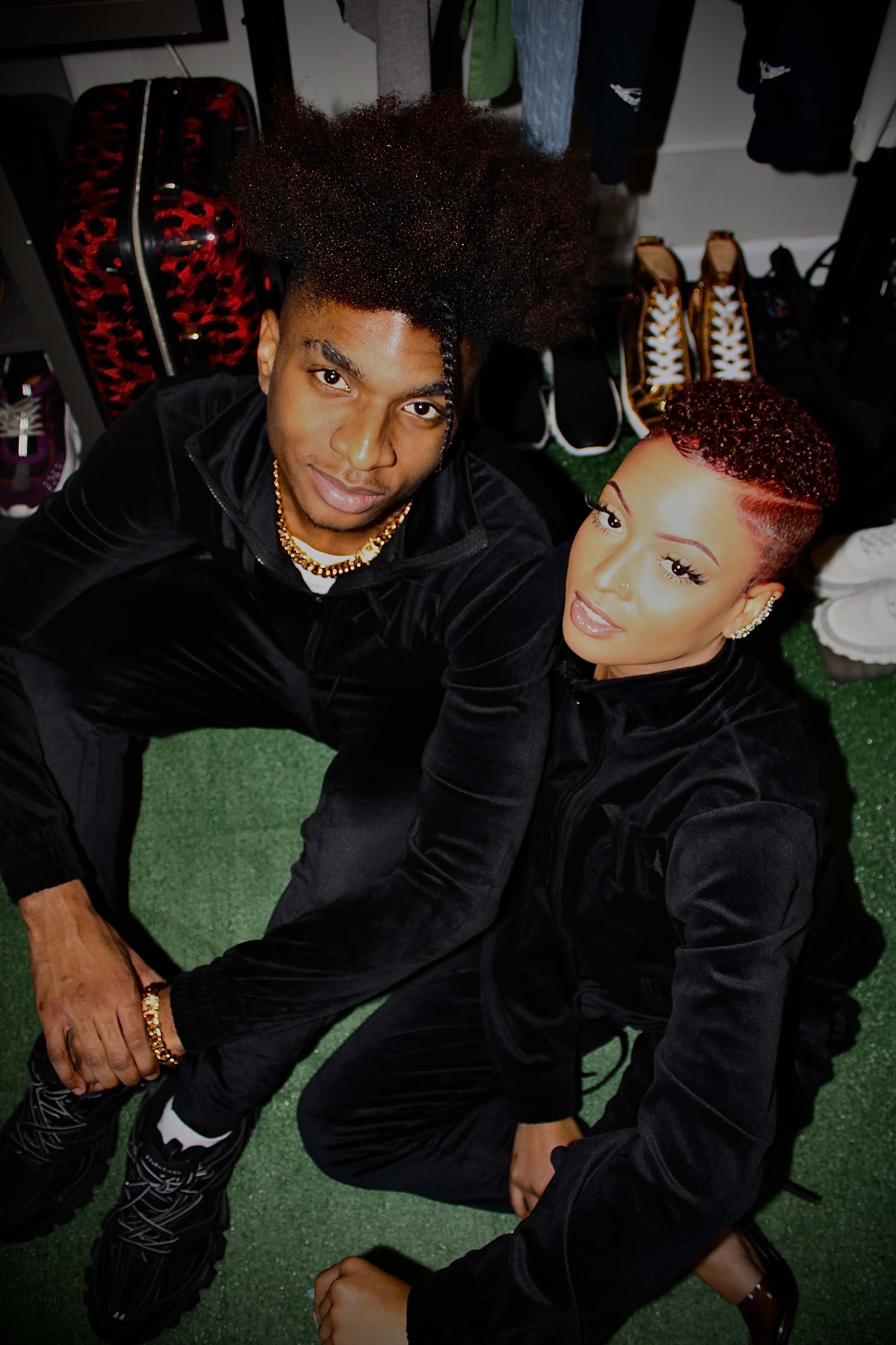 Black Velour Track Set Luxury Style & All-Day Comfort worn by a stylish couple in a cozy setting.