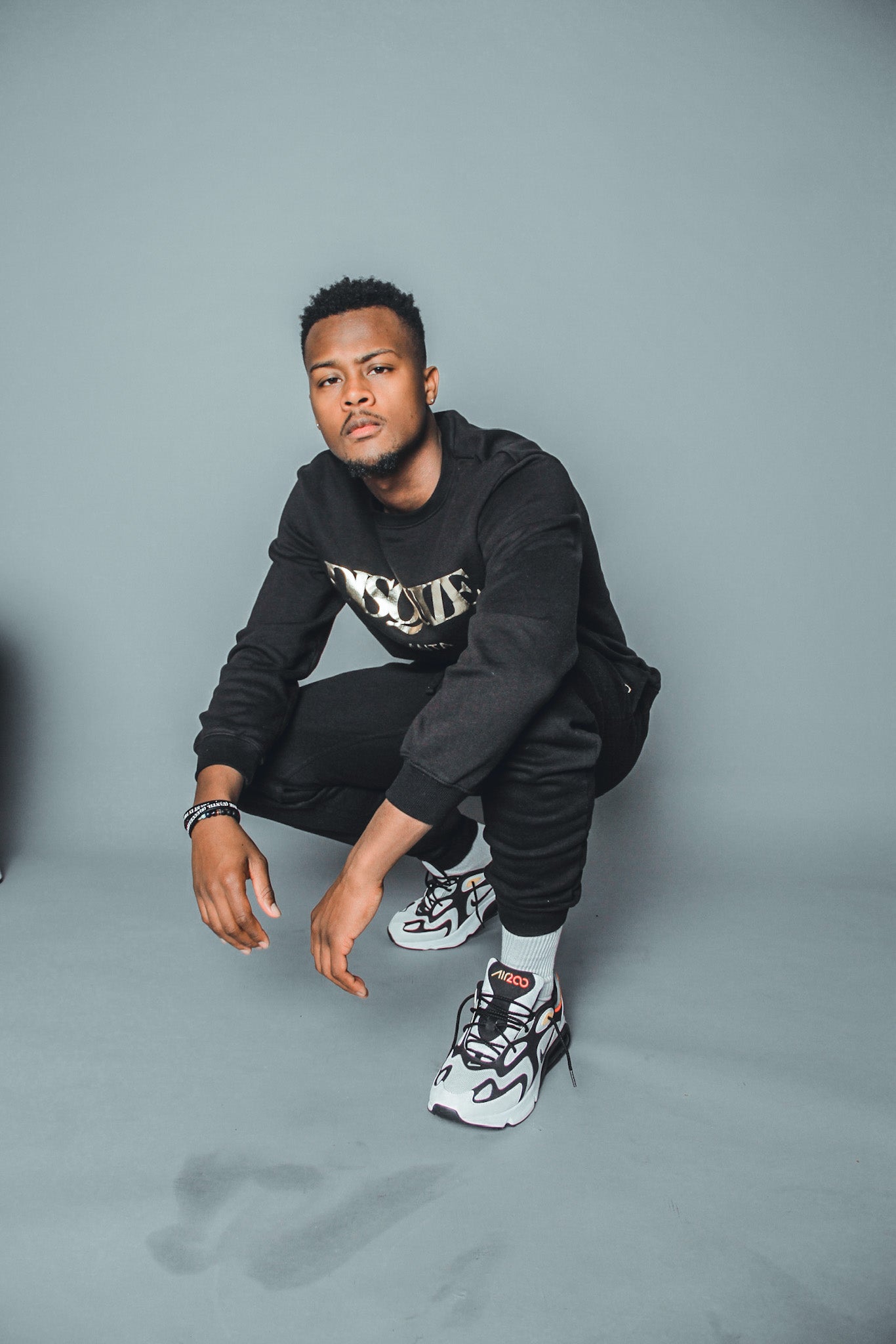 Black DISQUIZE sweat suit with matching crewneck and joggers